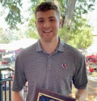 Delta Tau Delta's Will Scarborough with Ty Bridges Scholarship Award