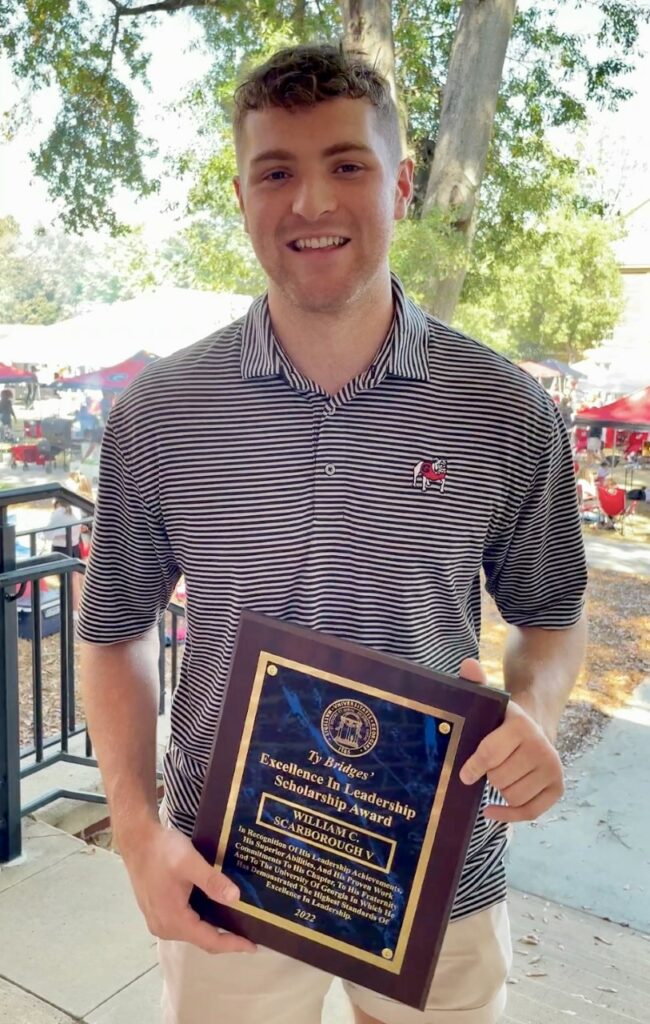 Delta Tau Delta's Will Scarborough with Ty Bridges Scholarship Award