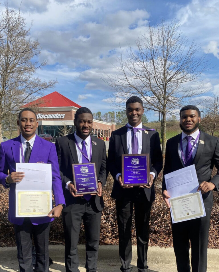 Omega Psi Phi with awards received at their District Meeting