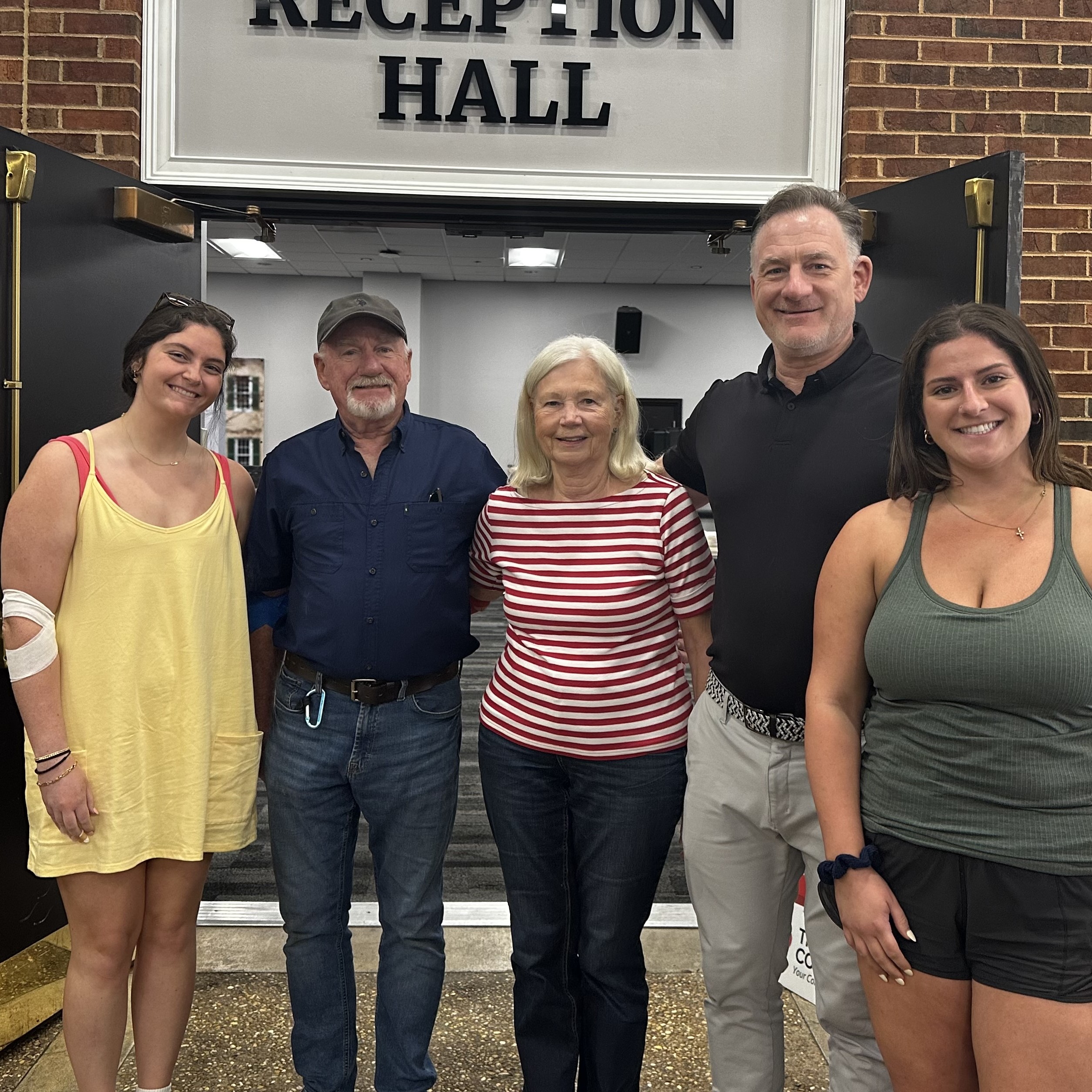 Morgan Delaney's family with Delta Gamma members at Morgan Delaney Memorial Blood Drive in March 2024